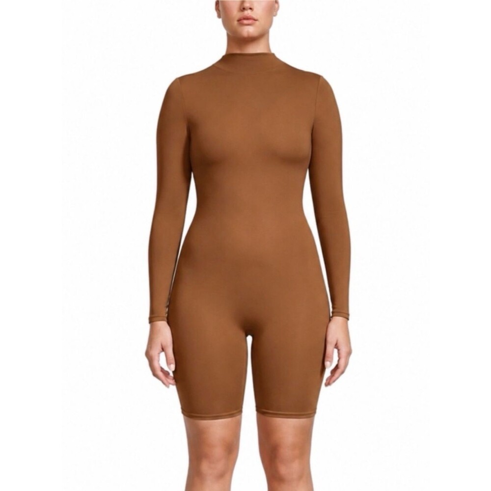 SKIMS All-In-One Long Sleeve Mid Thigh Onesie Bodysuit Romper in Sienna Tan S